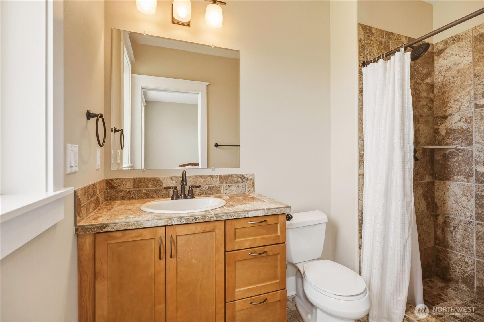 167 Rawhide Road Walla Walla, WA 99362 - Photo 32 of 40 a bathroom with a granite countertop sink toilet and shower
