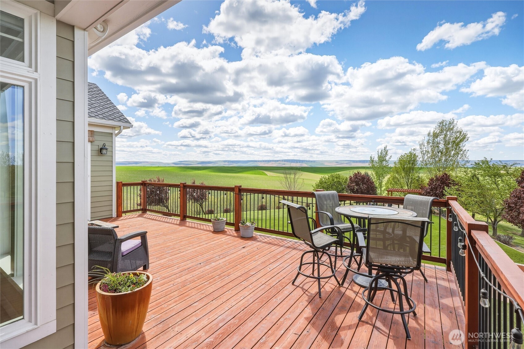 167 Rawhide Road Walla Walla, WA 99362 - Photo 10 of 40 a view of a balcony with chairs and wooden floor