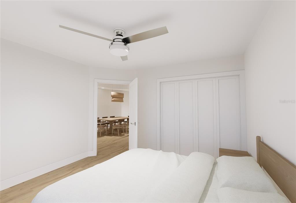 5015 Highway 19, Unit 503 New Port Richey, FL 34652 - Photo 23 of 24 a bedroom with a bed and a chandelier