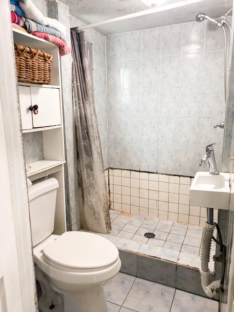 1900 Kenneth Street Modesto, CA 95351 - Photo 14 of 16 a bathroom with a sink toilet and shower