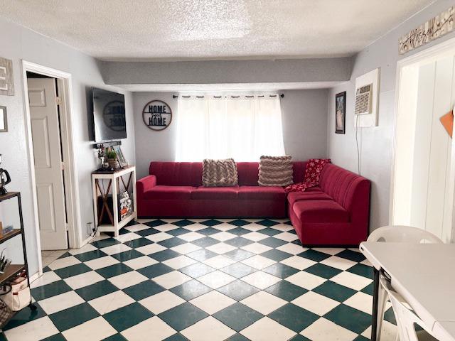 1900 Kenneth Street Modesto, CA 95351 - Photo 4 of 16 a living room with a black white checkered floor with a gaming machine and dining chairs