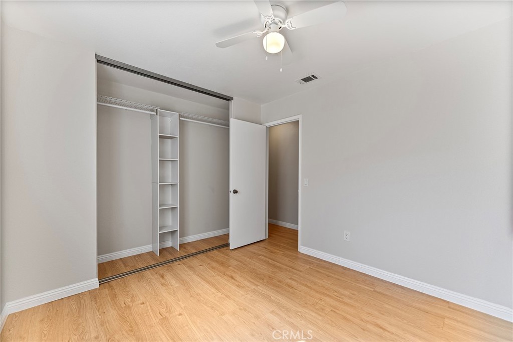 27875 Rainbow Lane Highland, CA 92346 - Photo 12 of 37 a view of an empty room with wooden floor
