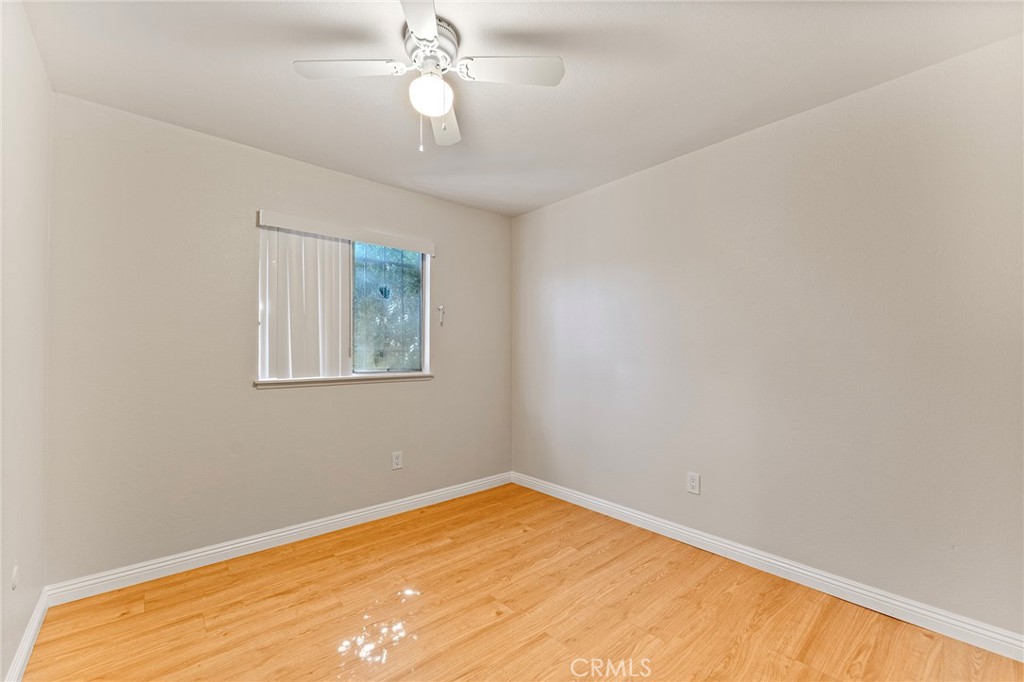 27875 Rainbow Lane Highland, CA 92346 - Photo 13 of 37 a view of empty room with wooden floor