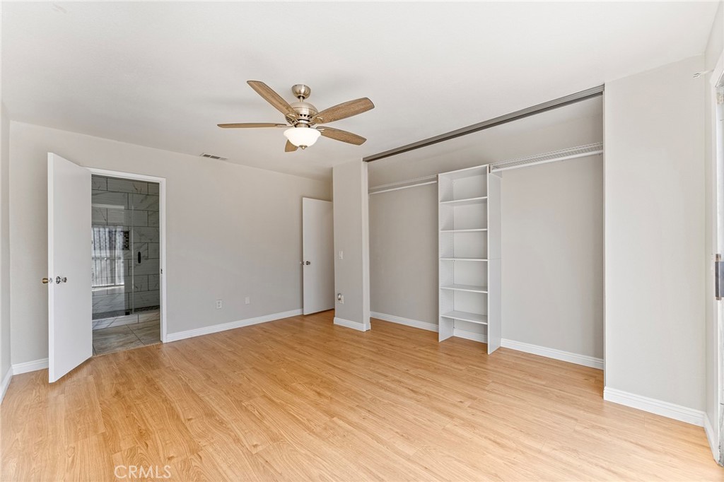 27875 Rainbow Lane Highland, CA 92346 - Photo 16 of 37 a view of empty room with wooden floor