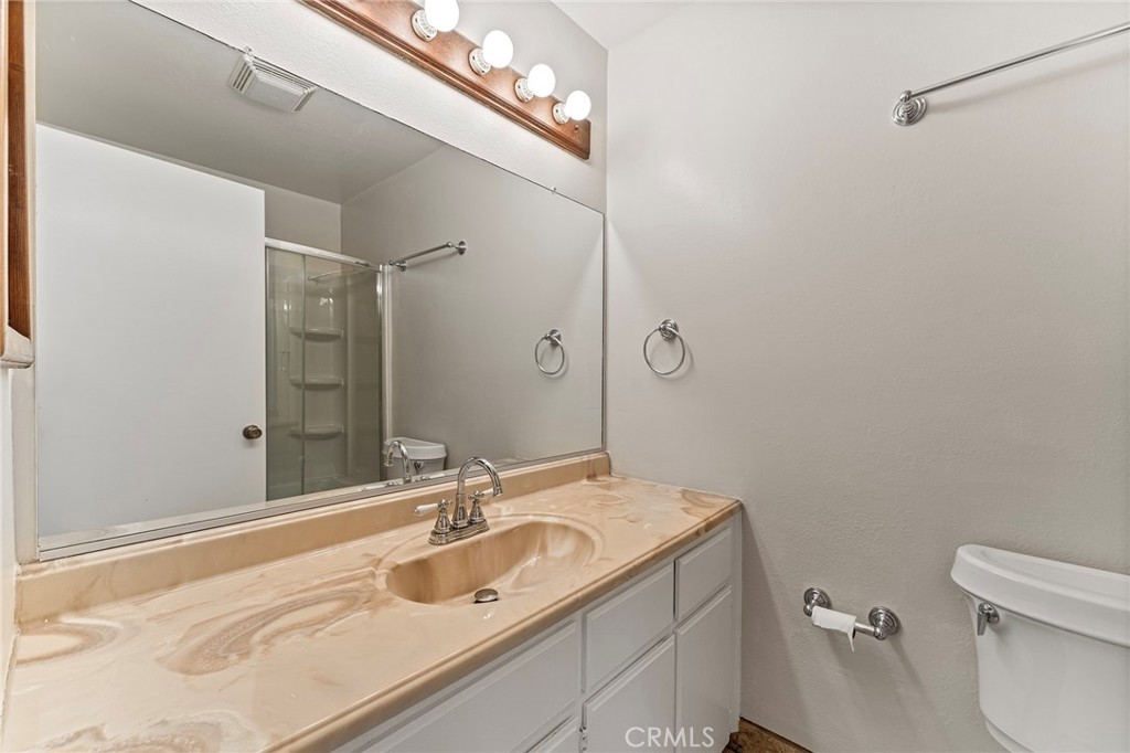 27875 Rainbow Lane Highland, CA 92346 - Photo 19 of 37 a bathroom with a sink a toilet and shower