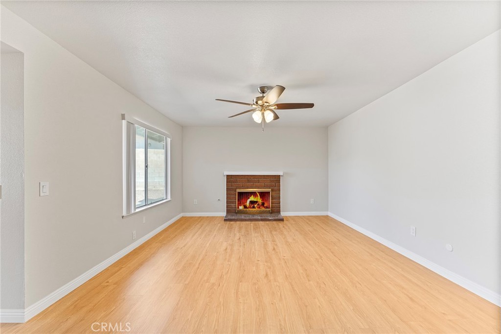 27875 Rainbow Lane Highland, CA 92346 - Photo 10 of 37 a view of a room with a ceiling fan and a window