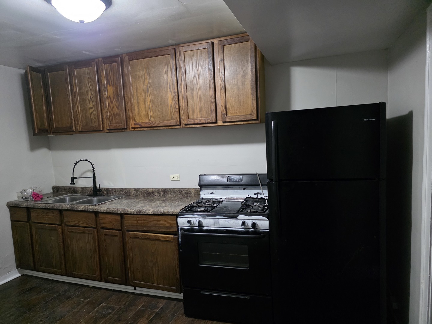 311 Memorial Drive, Unit 1 Calumet City, IL 60409 - Photo 7 of 7 a kitchen with stainless steel appliances granite countertop a refrigerator and a sink