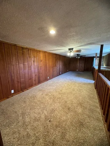 wooden floor in an empty room with stairs