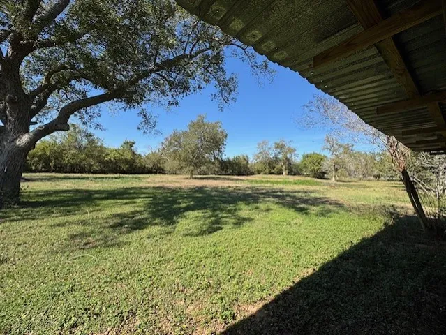 a view of a large yard with an outdoor space