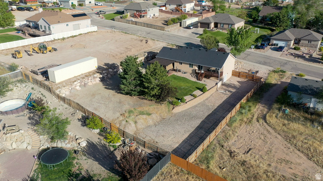 1797 Sunset Road Enoch, UT 84721 - Photo 73 of 80 Expansive lot featuring a single-story residence with a dark roof and a paved driveway