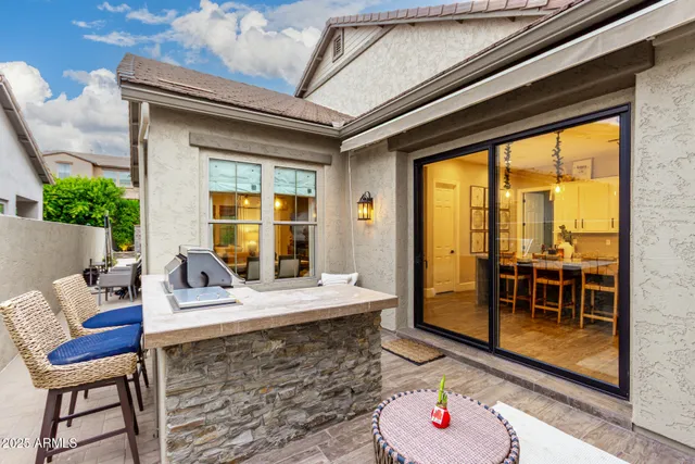 a dining room with furniture a chandelier and wooden floor