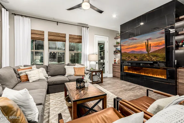 a bedroom with a large bed and a large window with outer view