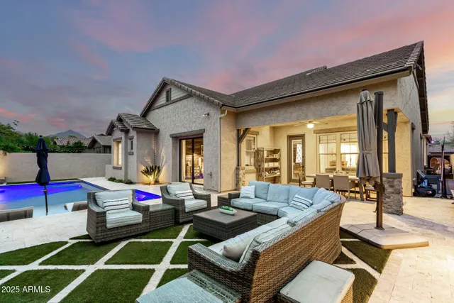 a view of a cafe with a table and chairs under an umbrella