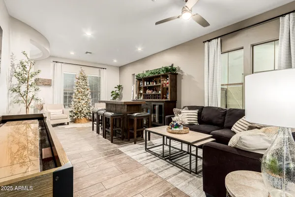 a kitchen with stainless steel appliances granite countertop a sink a stove and a refrigerator