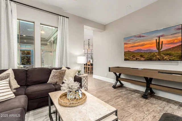 a kitchen with a refrigerator and a stove top oven