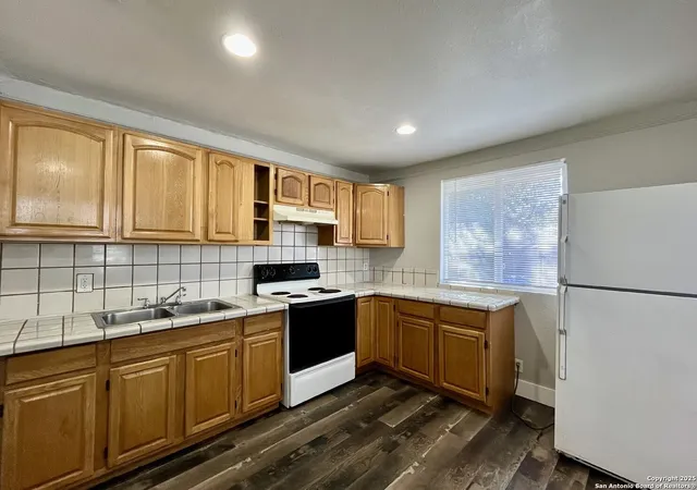 a kitchen with a stove and a sink