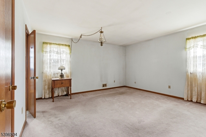 10 Red Oak Way Bridgewater, NJ 08807 - Photo 11 of 30 a view of a room with cabinet mirror and windows