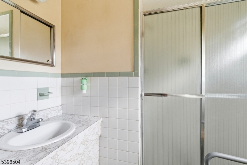 10 Red Oak Way Bridgewater, NJ 08807 - Photo 13 of 30 a bathroom with a sink and a mirror