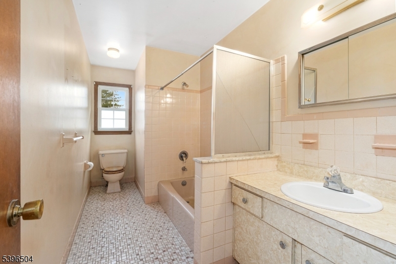 10 Red Oak Way Bridgewater, NJ 08807 - Photo 16 of 30 a bathroom with a sink a toilet and shower