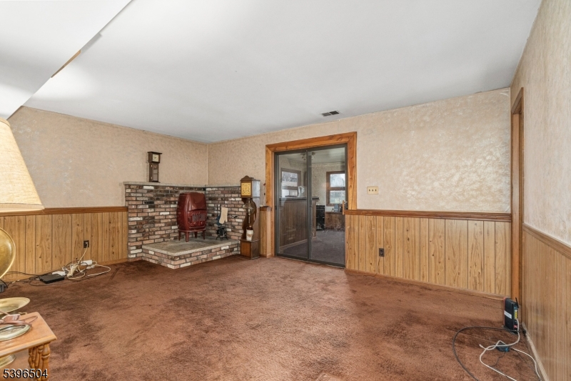 10 Red Oak Way Bridgewater, NJ 08807 - Photo 19 of 30 a view of a livingroom with furniture and a garage