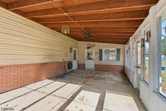 a bed room with a large window and outside view
