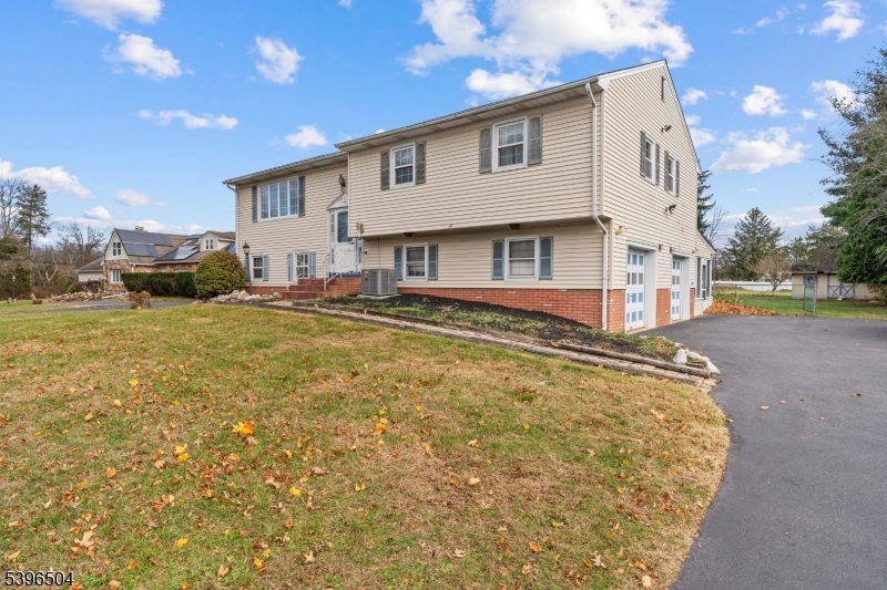 10 Red Oak Way Bridgewater, NJ 08807 - Photo 25 of 30 a view of a house with a yard and sitting area