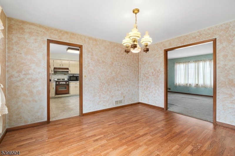 10 Red Oak Way Bridgewater, NJ 08807 - Photo 6 of 30 wooden floor in an empty room with a window