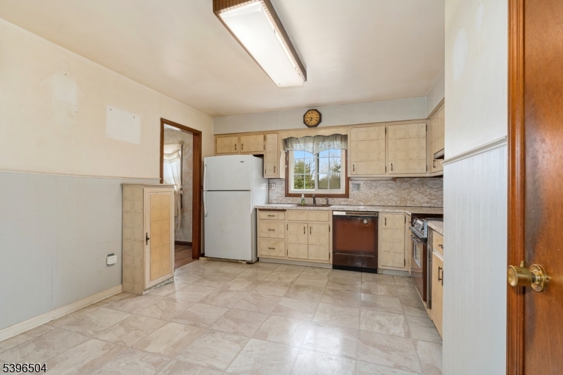 10 Red Oak Way Bridgewater, NJ 08807 - Photo 10 of 30 a view of a kitchen with refrigerator and window