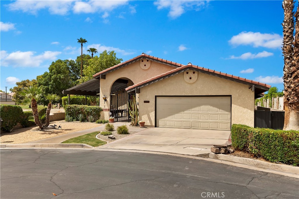 82072 Vandenberg Drive Indio, CA 92201 - Photo 1 of 1 a view of a house with outdoor space and parking area
