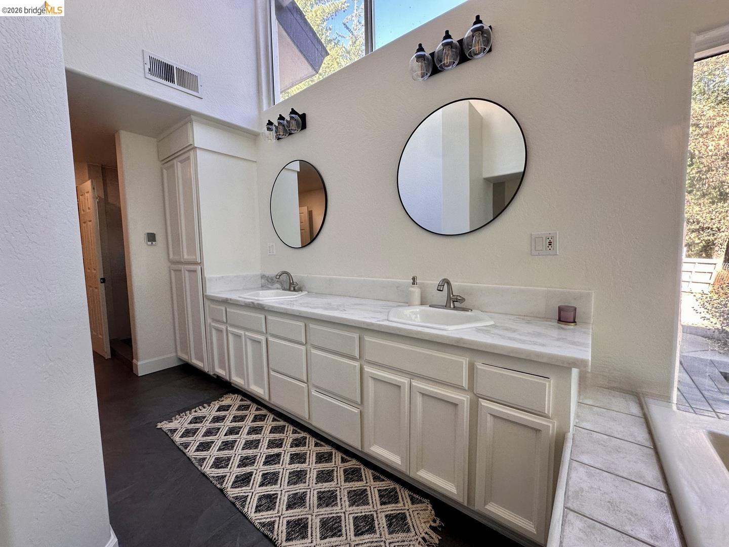 2080 Nelson Road Camino, CA 95709 - Photo 33 of 55 Dual vanity with light-colored cabinetry, white countertops, and integrated sinks