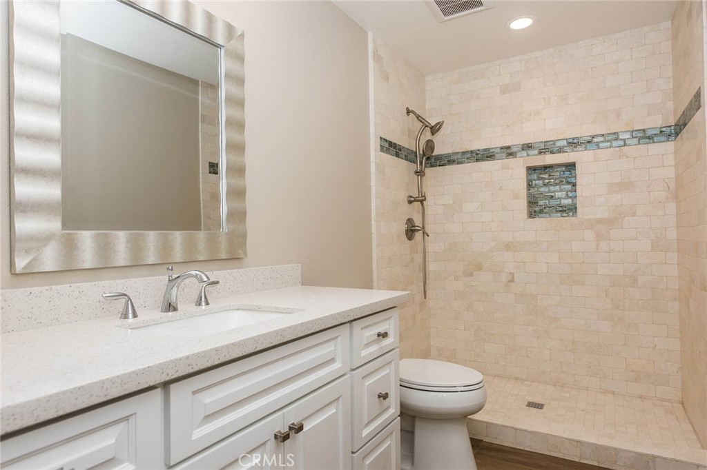 20 Acacia Tree Lane Irvine, CA 92612 - Photo 11 of 44 a bathroom with a sink toilet and shower