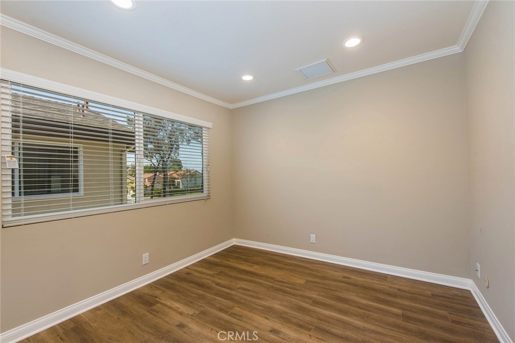 20 Acacia Tree Lane Irvine, CA 92612 - Photo 19 of 44 a view of empty room with wooden floor and fan