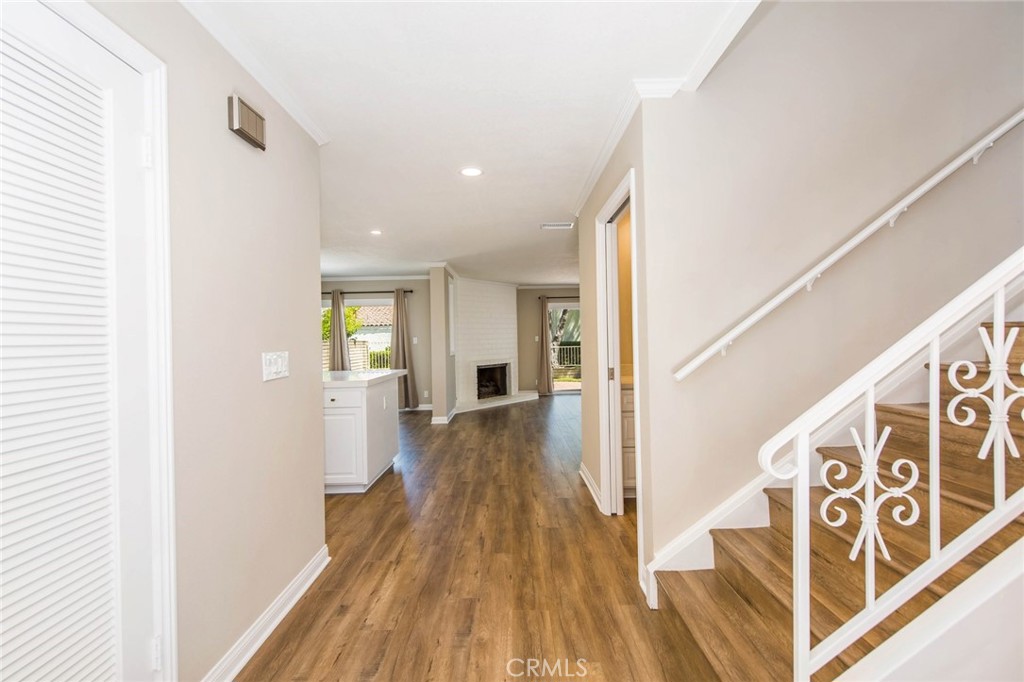 20 Acacia Tree Lane Irvine, CA 92612 - Photo 2 of 44 a view of a hallway with wooden floor and staircase