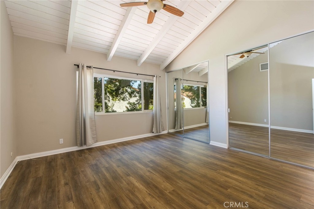 20 Acacia Tree Lane Irvine, CA 92612 - Photo 21 of 44 an empty room with wooden floor and windows
