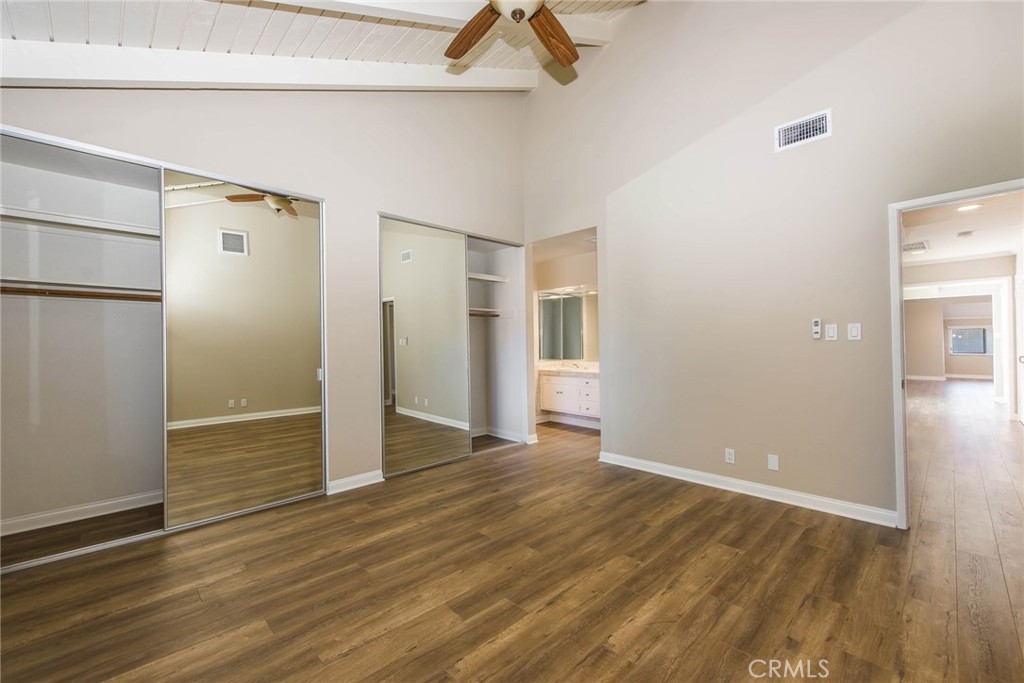 20 Acacia Tree Lane Irvine, CA 92612 - Photo 22 of 44 a view of an empty room with wooden floor