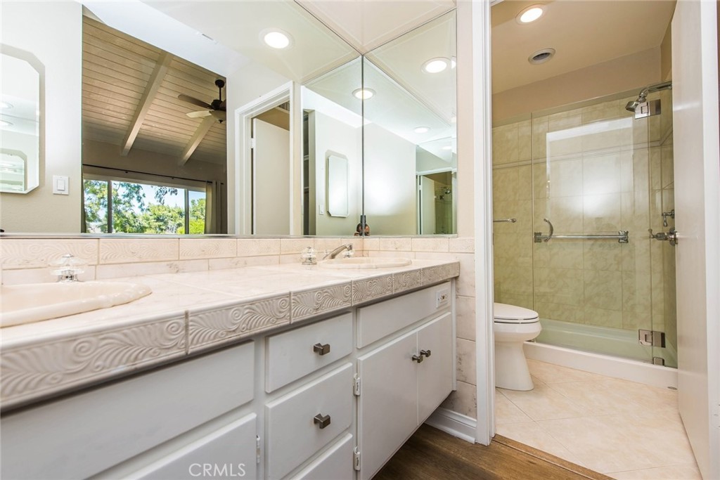 20 Acacia Tree Lane Irvine, CA 92612 - Photo 23 of 44 a bathroom with a double vanity sink toilet and shower