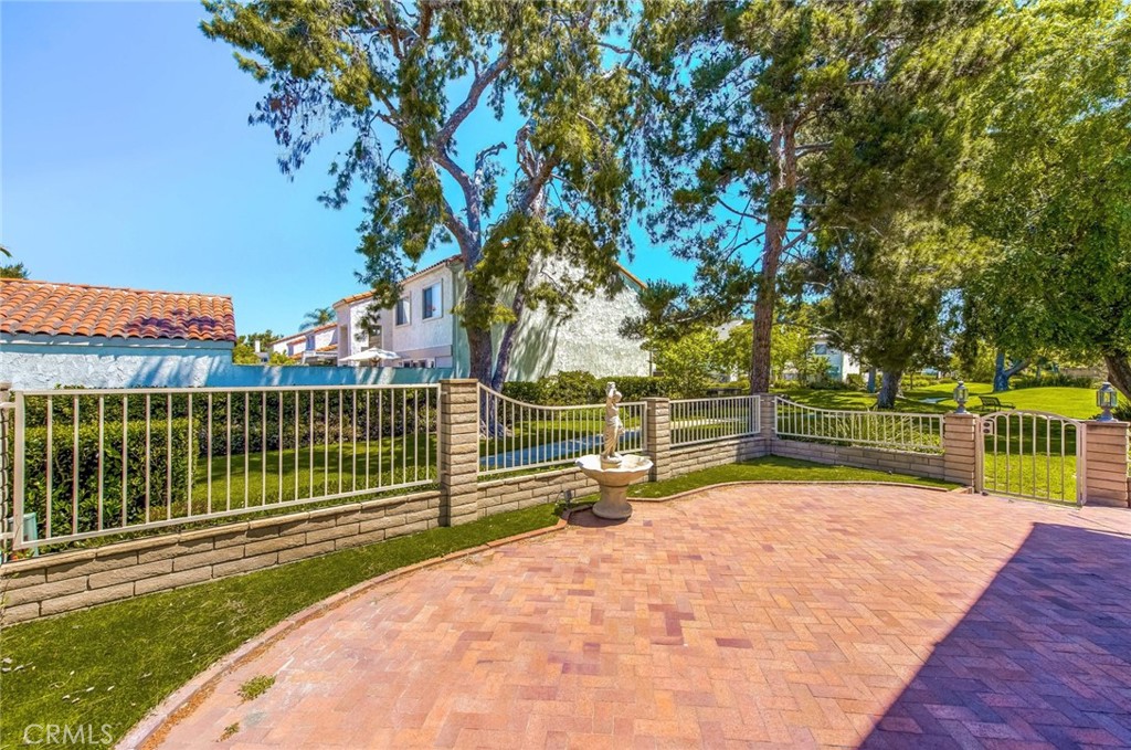 20 Acacia Tree Lane Irvine, CA 92612 - Photo 26 of 44 a view of a park with swings and a large tree