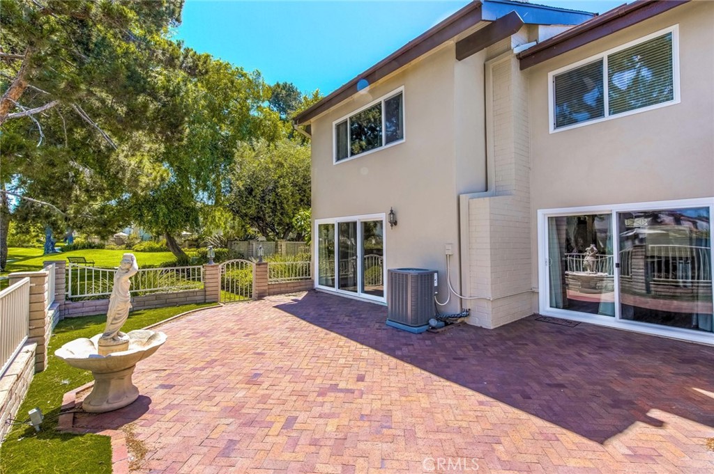 20 Acacia Tree Lane Irvine, CA 92612 - Photo 28 of 44 a front view of a house with garden