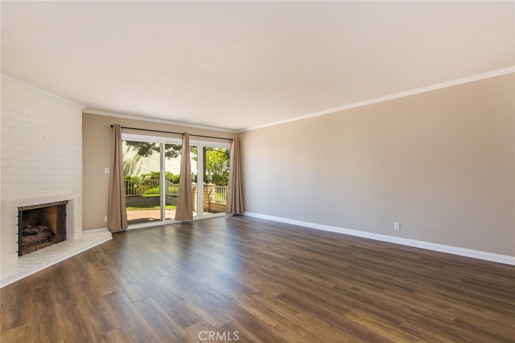 20 Acacia Tree Lane Irvine, CA 92612 - Photo 3 of 44 a view of an empty room with wooden floor and a window