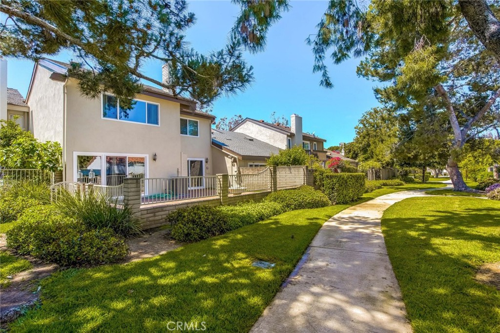 20 Acacia Tree Lane Irvine, CA 92612 - Photo 33 of 44 a front view of house with yard and green space