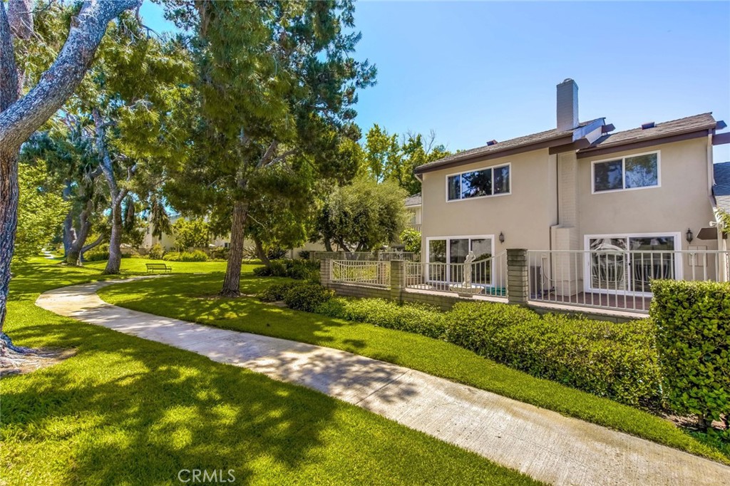 20 Acacia Tree Lane Irvine, CA 92612 - Photo 34 of 44 a front view of a house with a yard