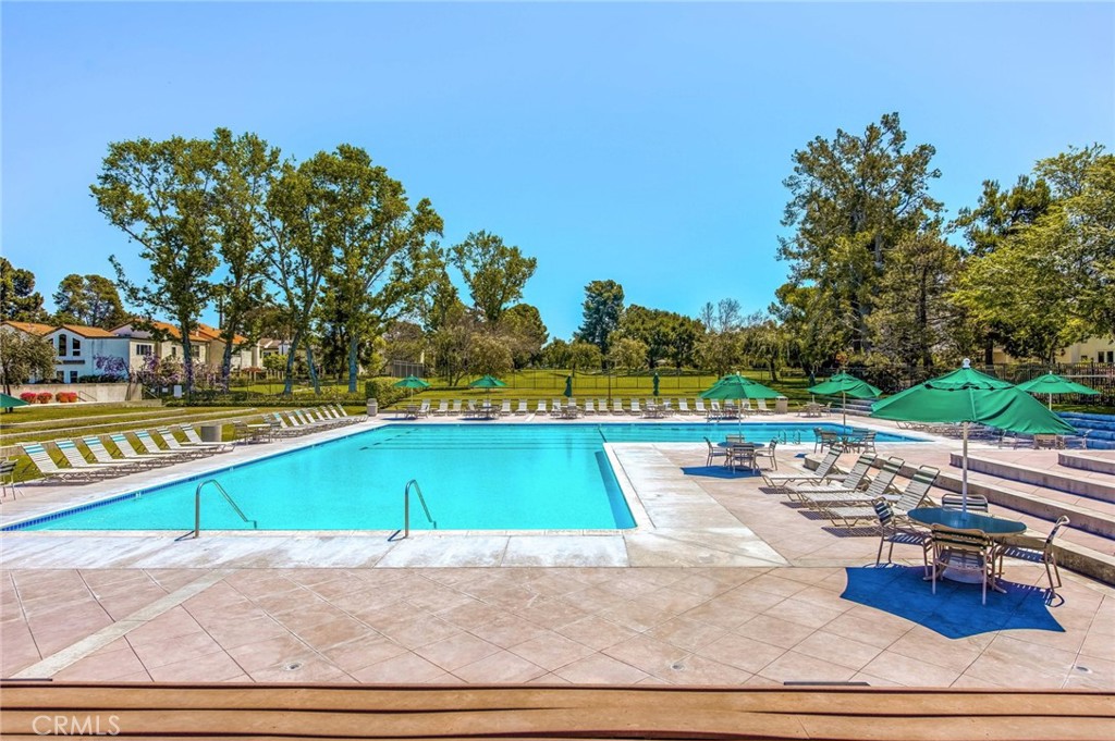 20 Acacia Tree Lane Irvine, CA 92612 - Photo 42 of 44 a view of a swimming pool with an outdoor space and seating area