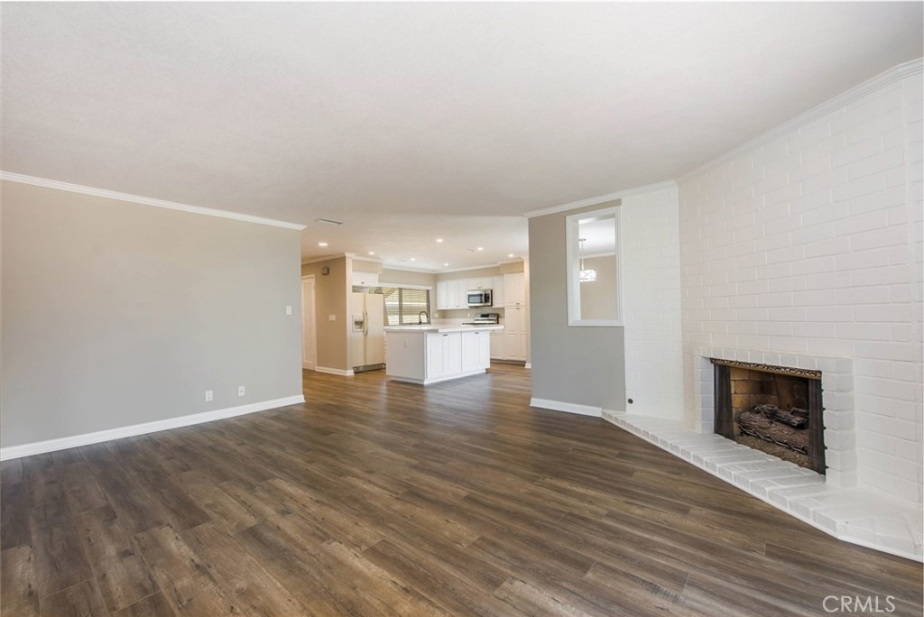 20 Acacia Tree Lane Irvine, CA 92612 - Photo 5 of 44 a view of empty room with wooden floor and fireplace