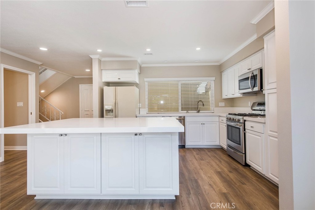20 Acacia Tree Lane Irvine, CA 92612 - Photo 7 of 44 a kitchen with a sink stove and refrigerator
