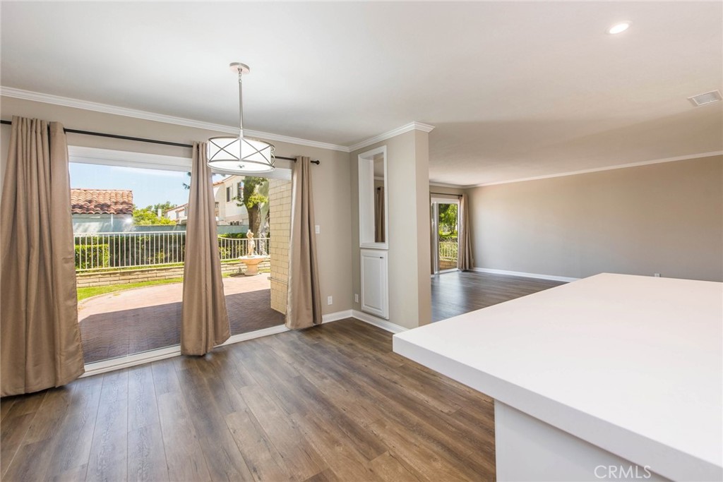20 Acacia Tree Lane Irvine, CA 92612 - Photo 9 of 44 a view of empty room with wooden floor and fan