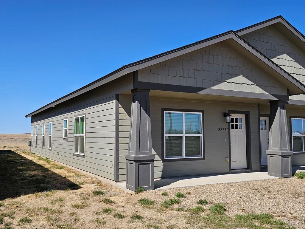 28651 County Road 24.6 Springfield, CO 81073 - Photo 16 of 18 a front view of a house with a yard
