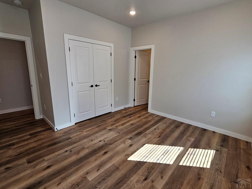 28651 County Road 24.6 Springfield, CO 81073 - Photo 9 of 18 a view of a room with wooden floor and white walls