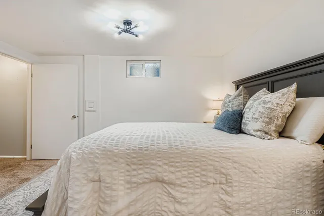 a large white bed in a white room