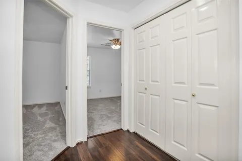 a view of a bathroom with wooden floor