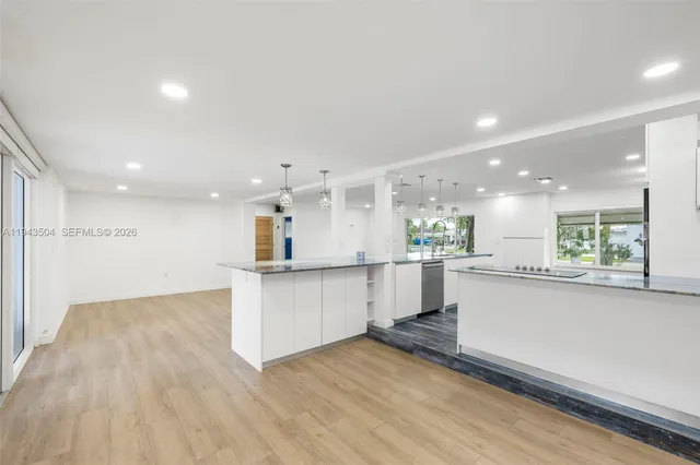 a view of kitchen with wooden floor
